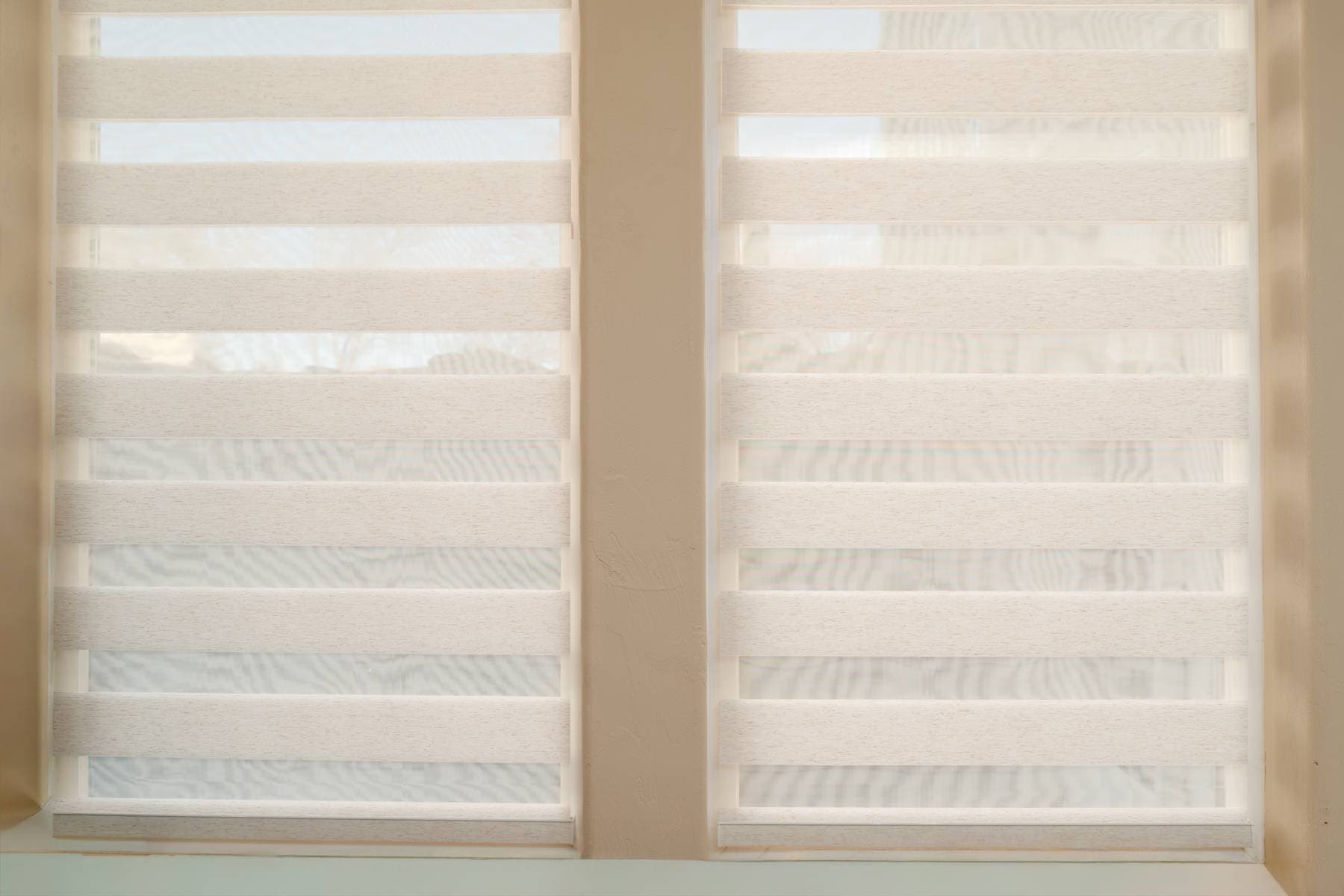 Roller shades in a bright living room